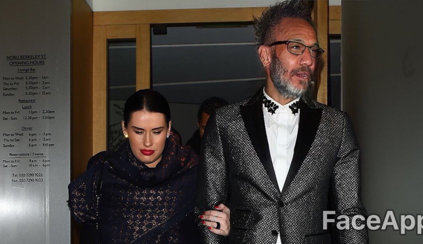 A man in a suit and a woman in a tuxedo.