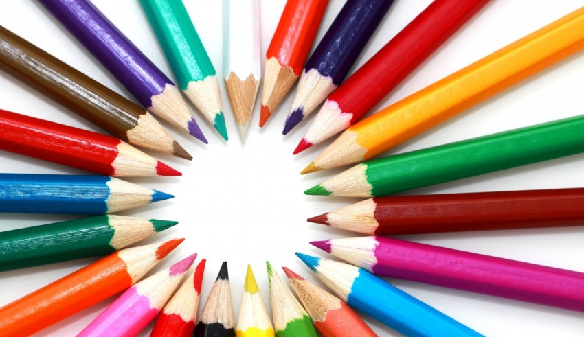Colorful pencils arranged in a circle on a white background.
