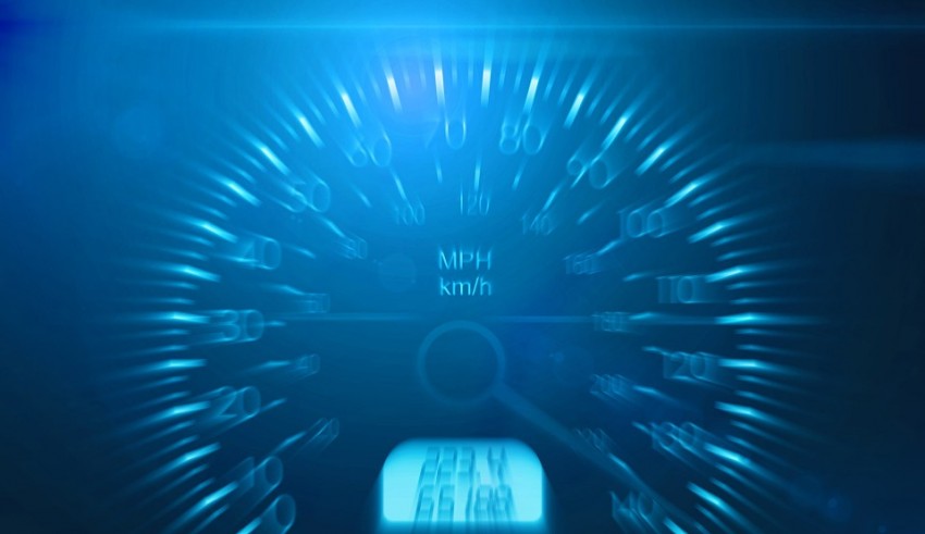 A blue speedometer on a dark background.