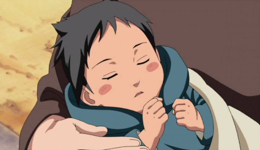 An anime character is holding a baby in his arms.