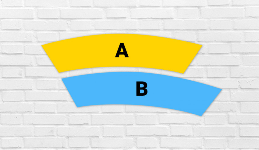 A blue and yellow cup with the letters a and b on it.