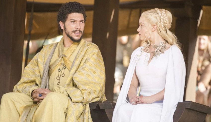 A man and a woman sitting on a bench in game of thrones.