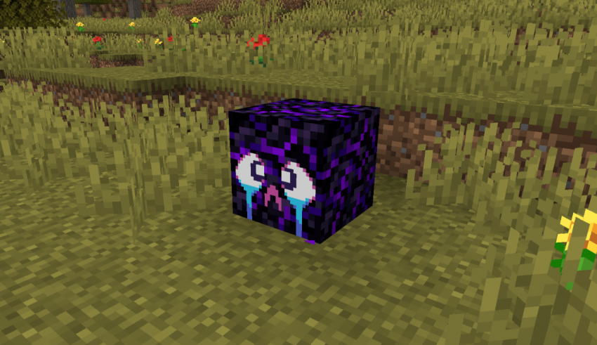 A purple block in the middle of a field.