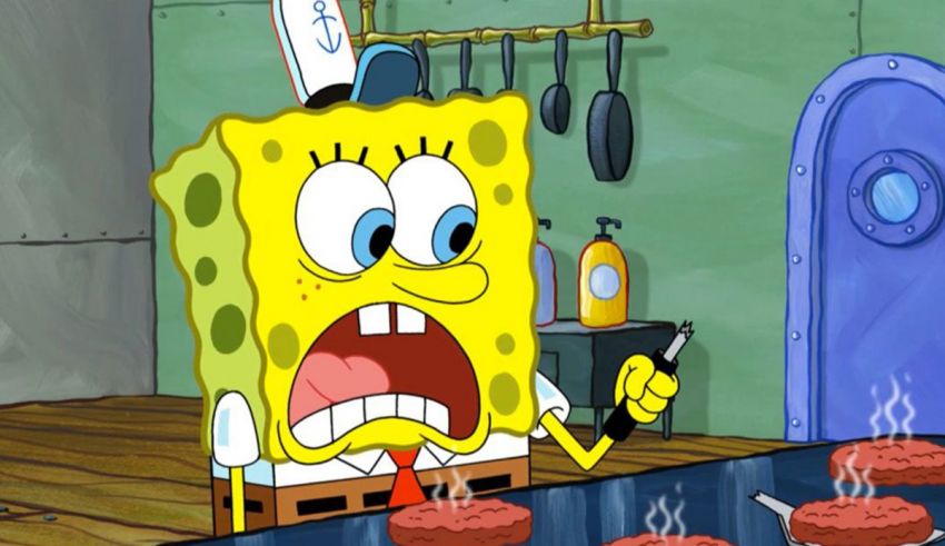 Spongebob squarepants is cooking hamburgers in a kitchen.