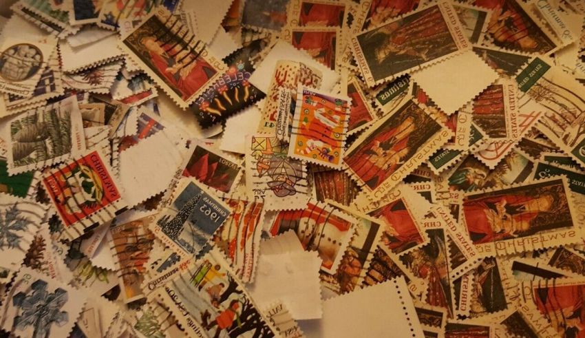A pile of postage stamps on a table.