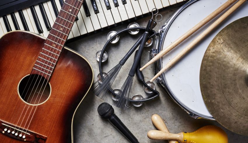 An acoustic guitar, drums, keyboard and other musical instruments.