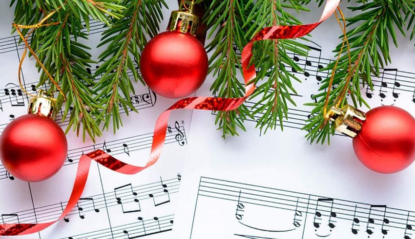 Christmas ornaments on a sheet of music.
