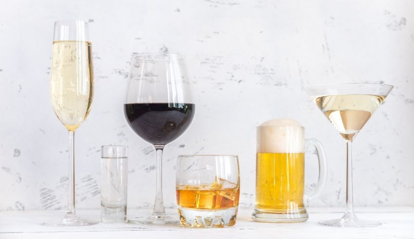 A group of glasses with different types of alcohol.