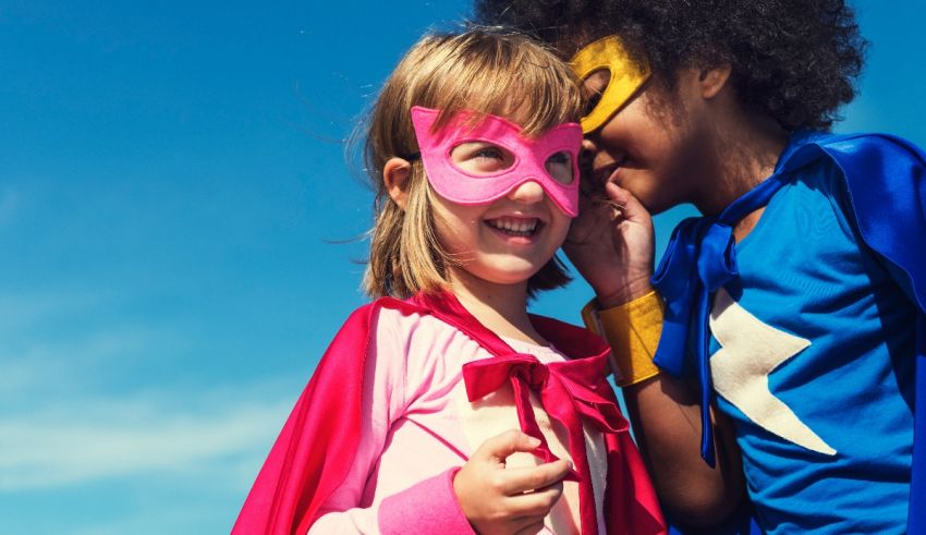 Two children dressed up as superheroes.