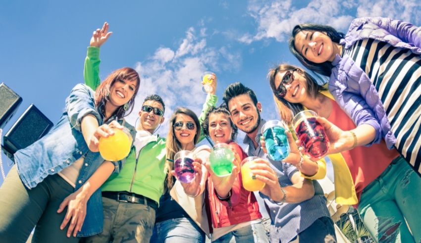 A group of young people are holding drinks in their hands.