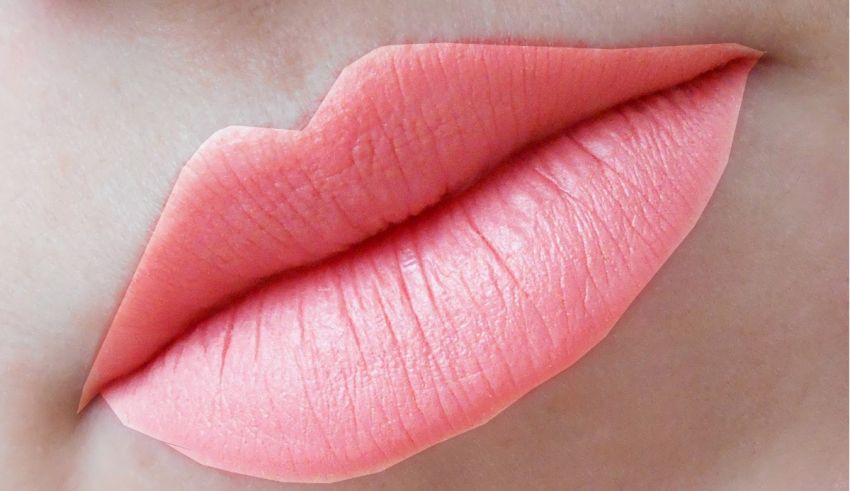 A close up of a woman's pink lips.