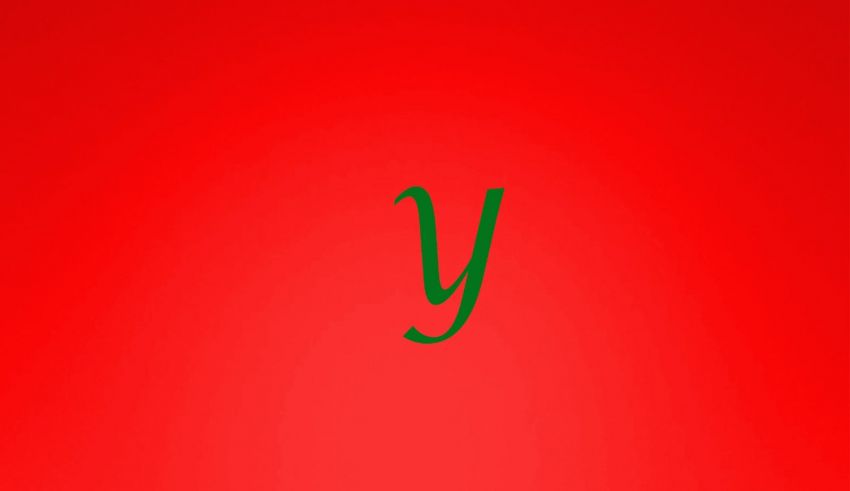 A green letter y on a red background.