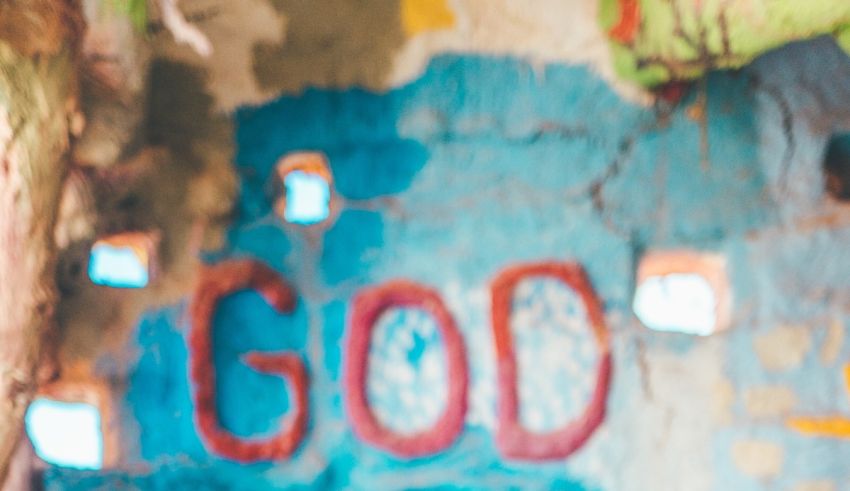 A painted wall with the word god on it.