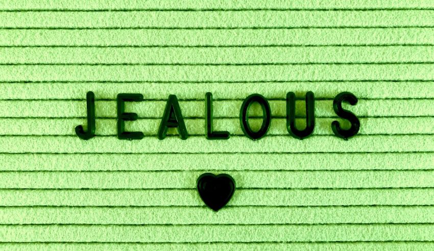 A green background with the word jealous on it.