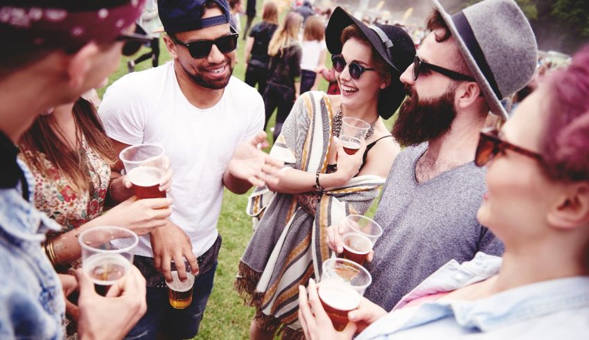 A group of people drinking beer at a festival.
