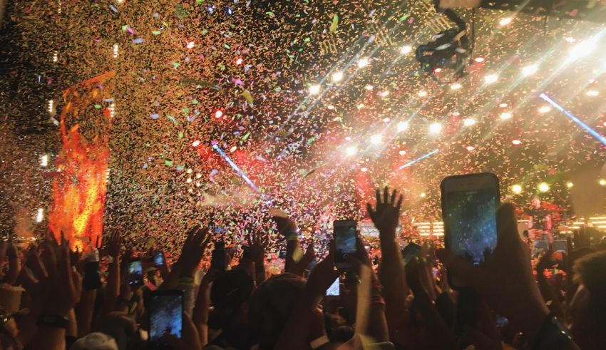 Confetti falling from the sky at a concert.