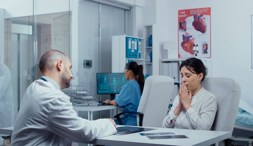 A doctor is talking to a patient in a medical office.