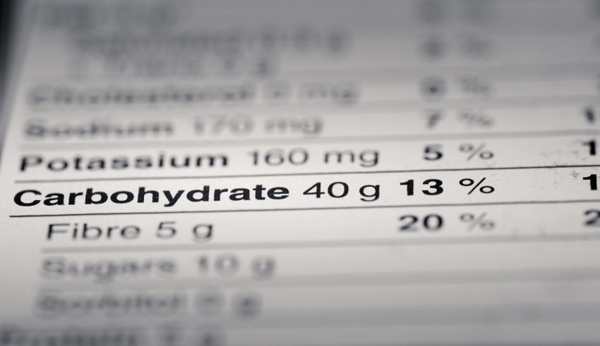 A close up of a nutrition label showing the amount of carbohydrate in a food.