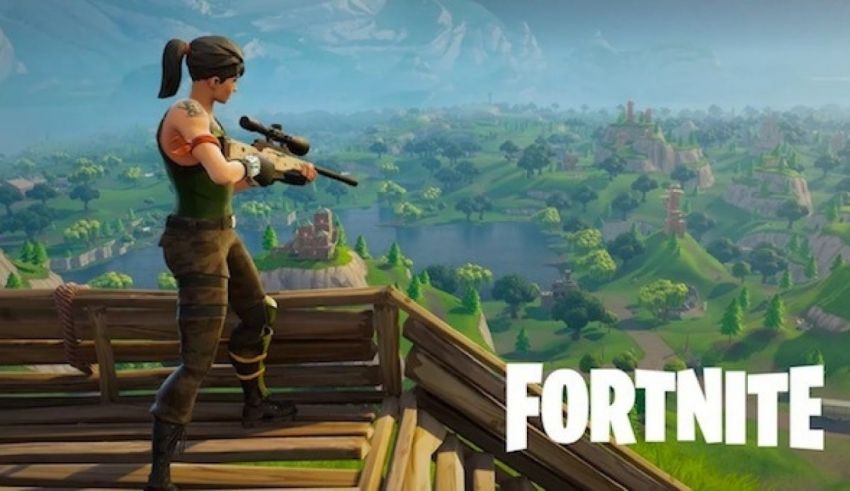 A woman is standing on top of a hill in fortnite.