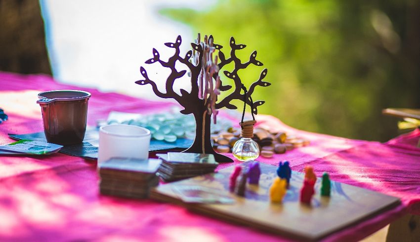 A pink tablecloth with a tree on it.