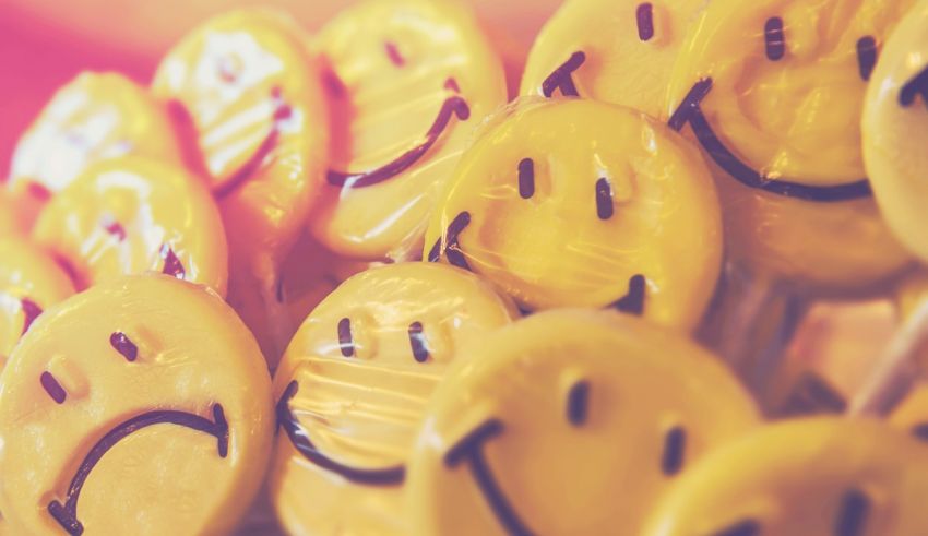 A bunch of yellow smiley faces on a stick.