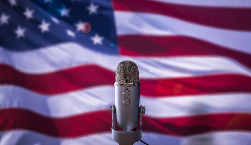 A microphone in front of an american flag.