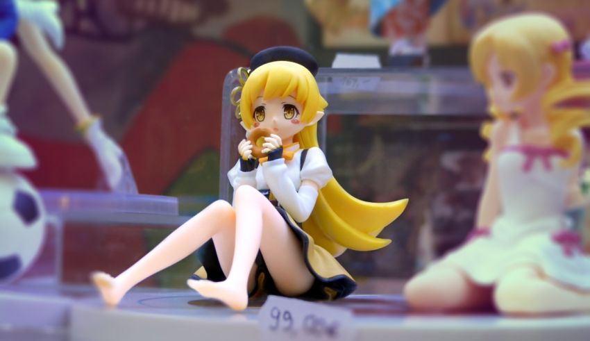 A figurine of a girl sitting on a table.