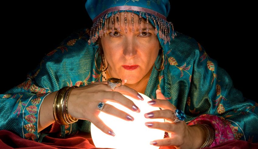 A woman holding a crystal ball.