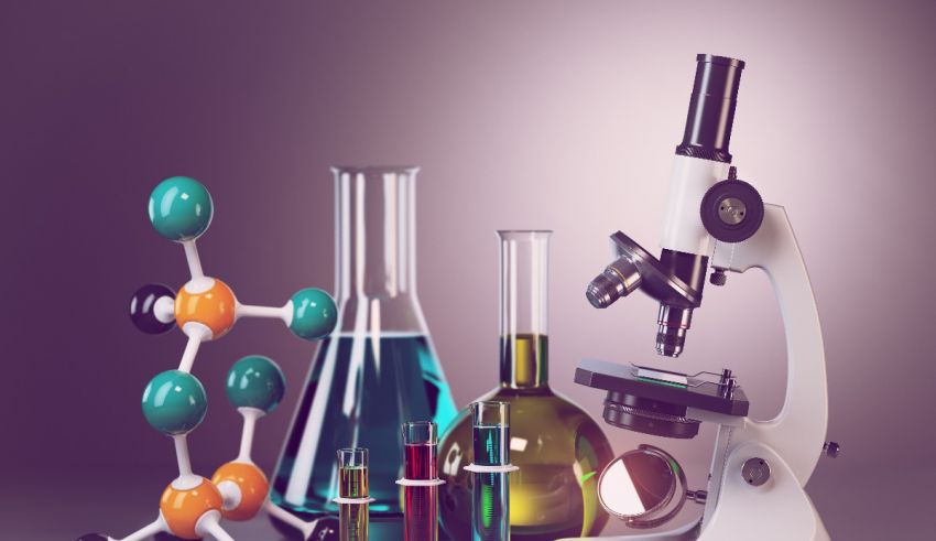 A microscope, a flask, and other laboratory equipment on a purple background.