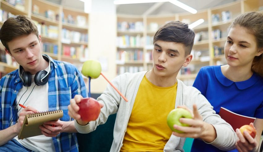 A group of young people are sitting in a library.