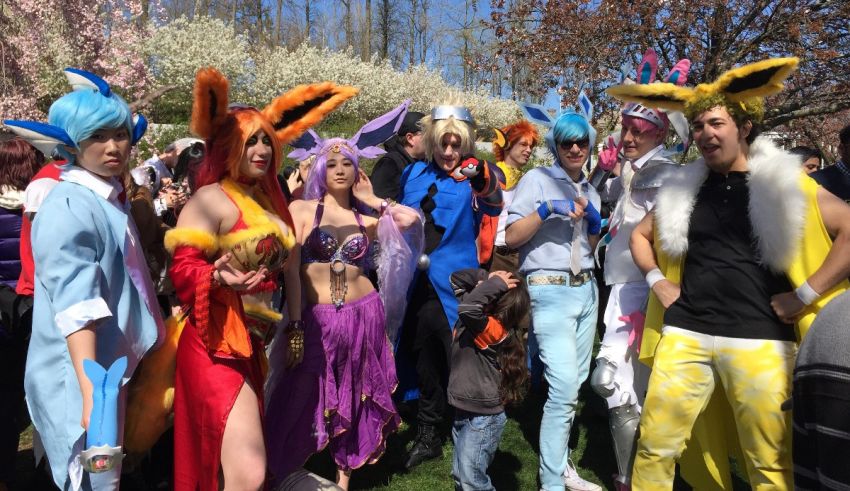 A group of people posing for a photo at a cosplay convention.