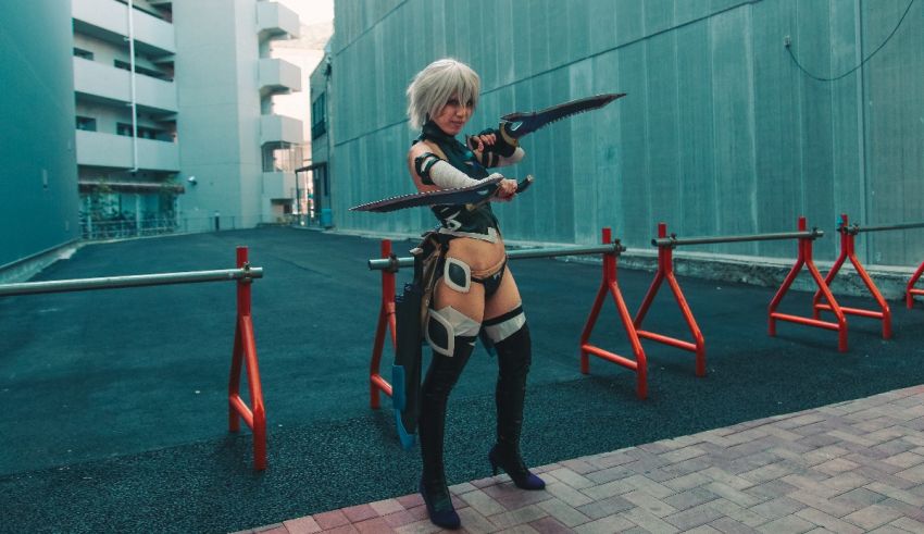 A female cosplayer holding a sword in front of a building.
