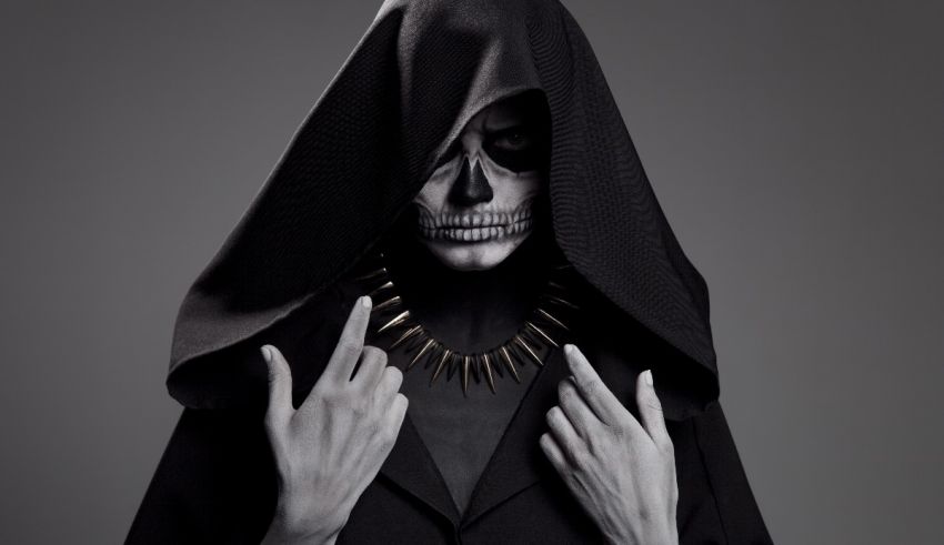 A skeleton in a black hooded cloak.