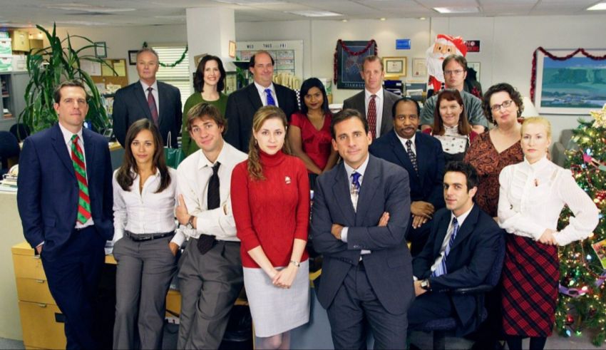 A group of people posing for a picture in an office.