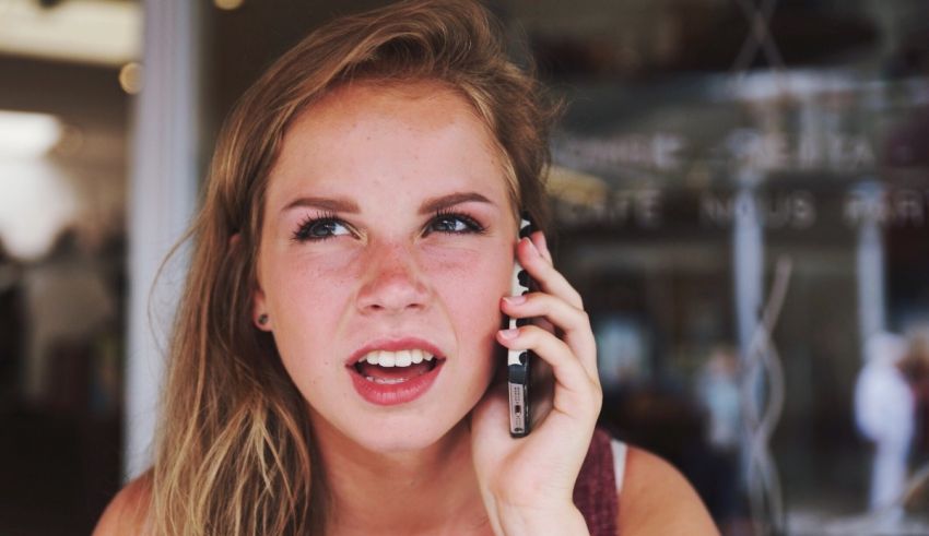 A young woman talking on a cell phone.