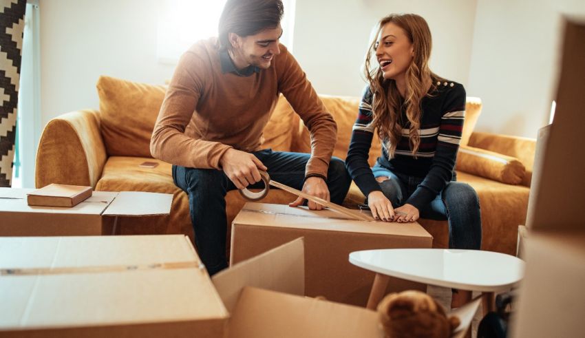 A man and woman are moving into a new home.