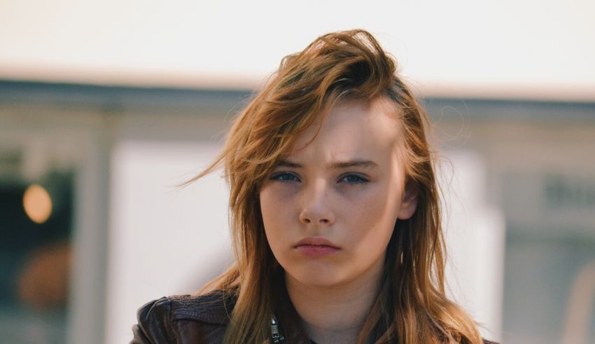 A young woman in a leather jacket.