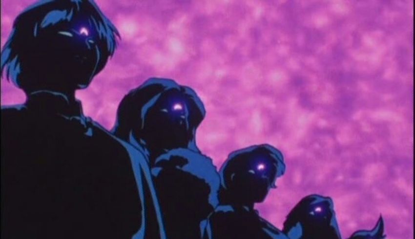 A group of people standing in front of a purple sky.