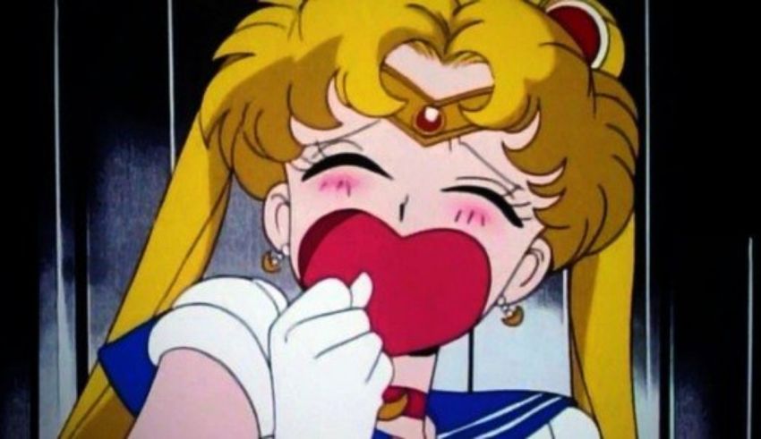 Sailor moon with a heart in her mouth.