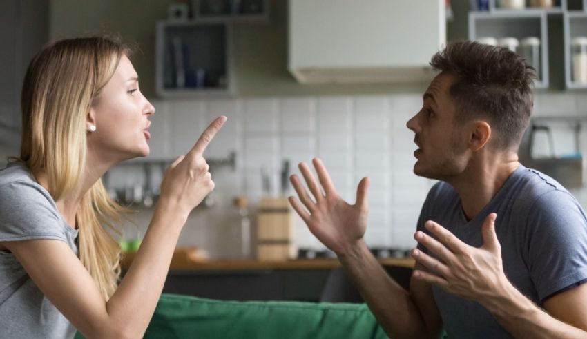 A man and woman arguing in the living room.