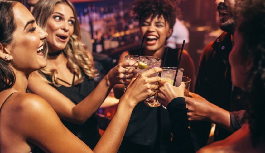 A group of friends toasting at a nightclub.