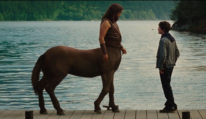 A man is standing next to a horse on a dock.