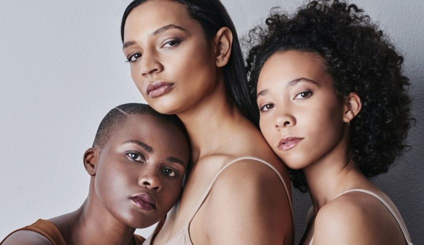 Three black women posing for a photo.