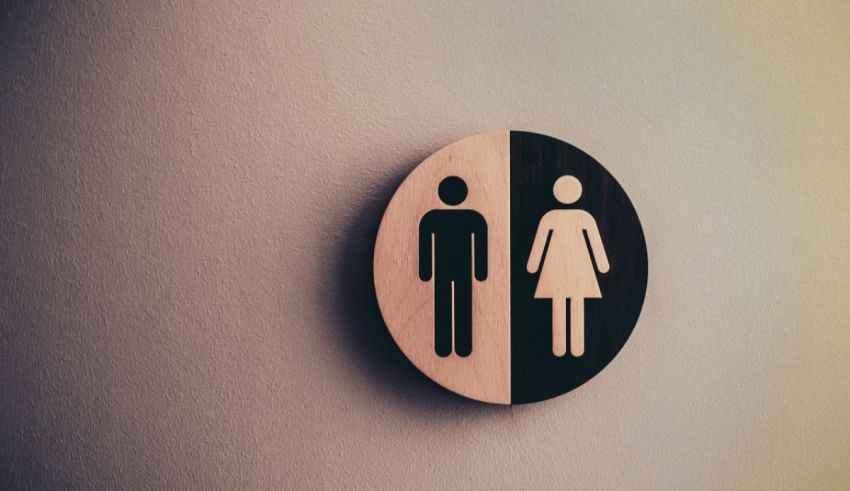 A wooden sign with a man and woman on it.