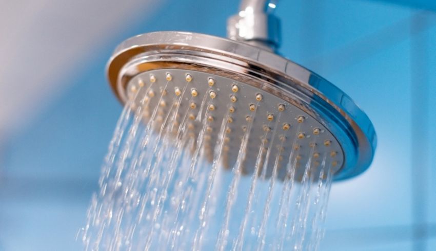 A shower head with water coming out of it.