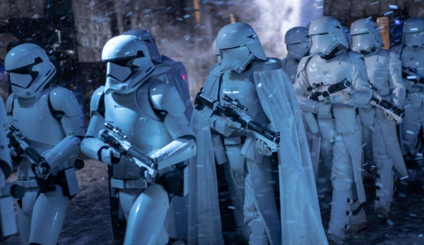 A group of star wars stormtroopers standing in a snowy street.