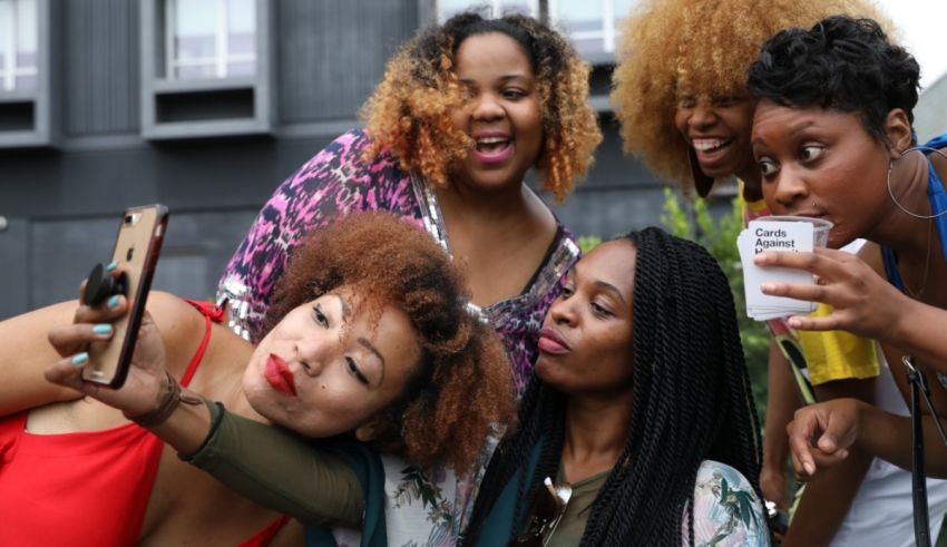 A group of women are taking a selfie together.
