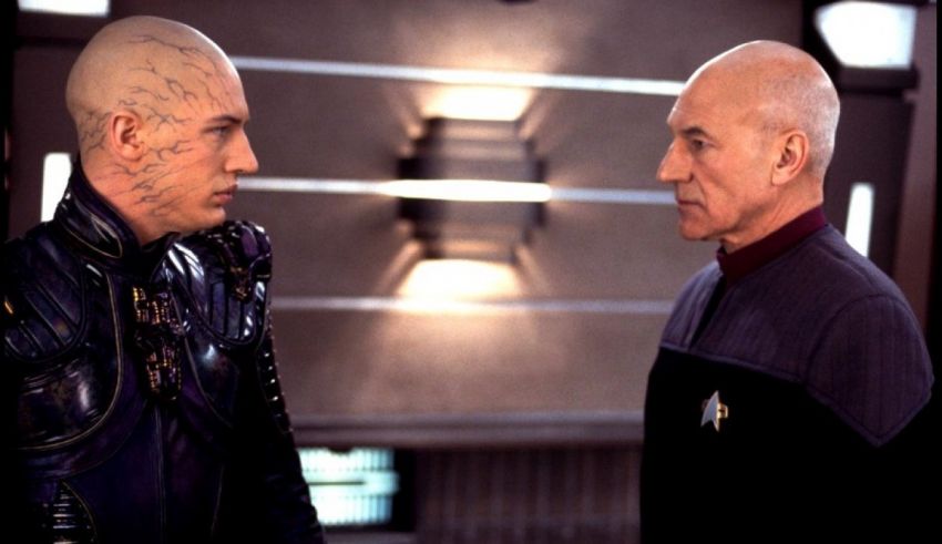 Two men standing next to each other in star trek.