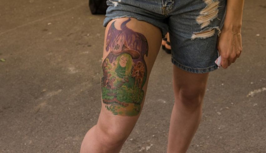 A woman with a tattoo on her thigh.