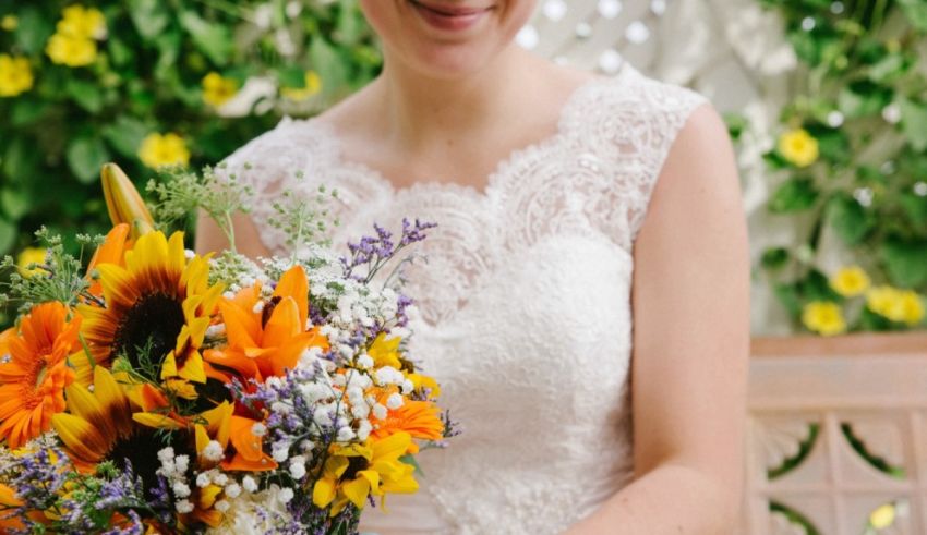 A bride holding a bouquet of sunflowers.